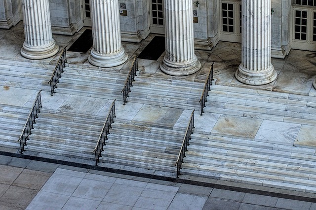 Aerial view of a grand building in Pennsylvania with multiple sets of marble stairs leading up to a row of classical white columns.