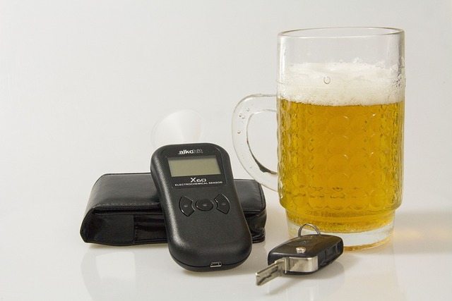 beer glass, breathalyzer, and car key