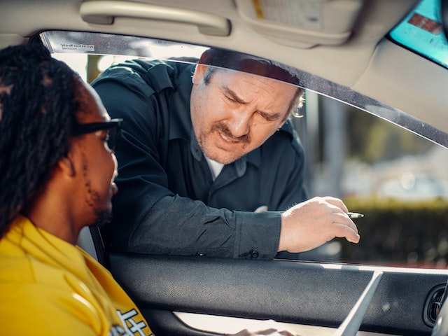 officer talking to man