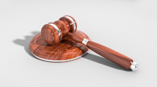 brown gavel on white background